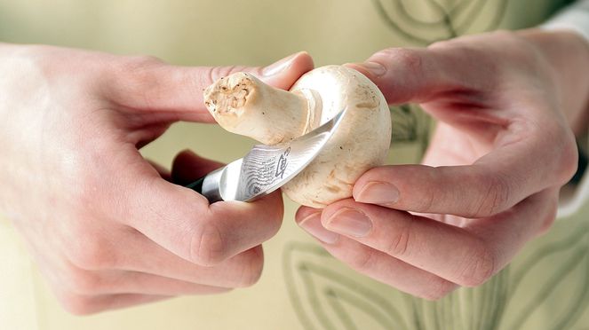 
                    Peeling knife peeling mushroom