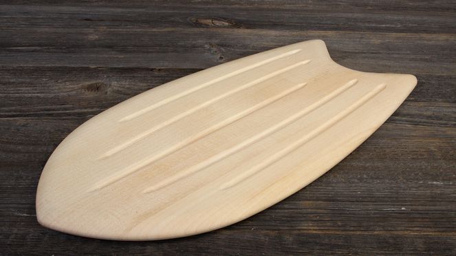 
                    The bread cutting board reminds of a surfboard