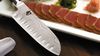 
                    Le couteau de cuisine alvéolé avec Sashimi