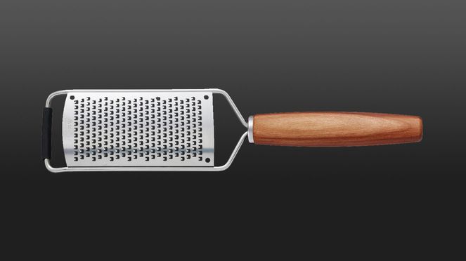 
                    Cheese grater triangle® with handle made of fine plum wood