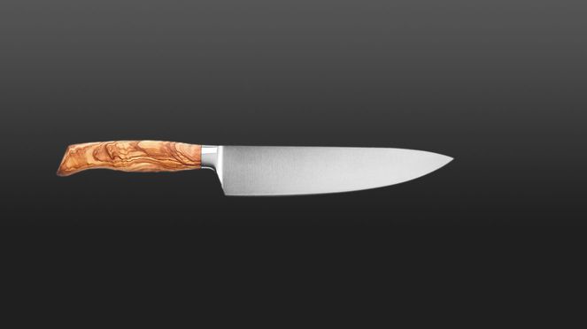 
                    The handle of the chef's knife Wok is made of grained olive wood